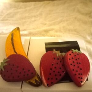 Used,not  new plastic  large 🍌 pin with attached strawberry 🍓 and earrings
